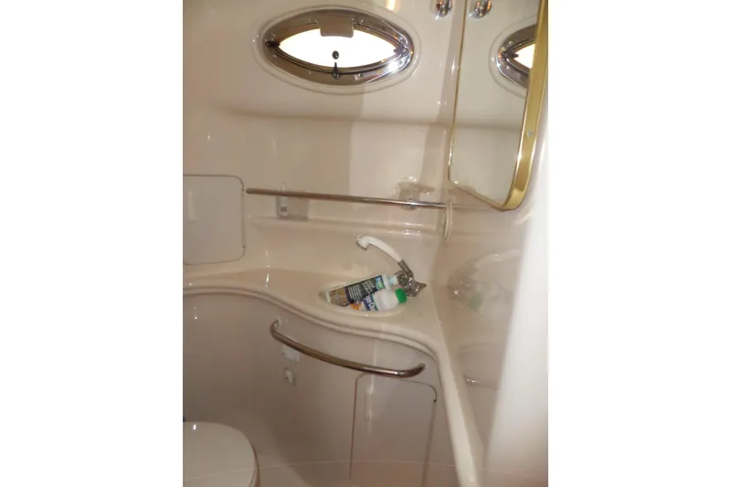 Slide: The Image of Bathroom interior of 2000 Sea Ray 340 Sundancer yacht, featuring sink and mirror. - 53