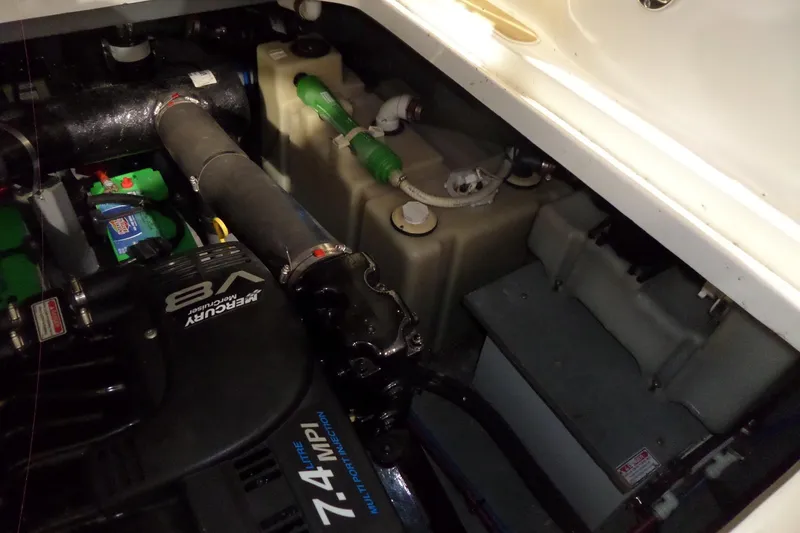 Slide: The Image of Engine compartment of 2000 Sea Ray 340 Sundancer with Mercury V8 engine components. - 59