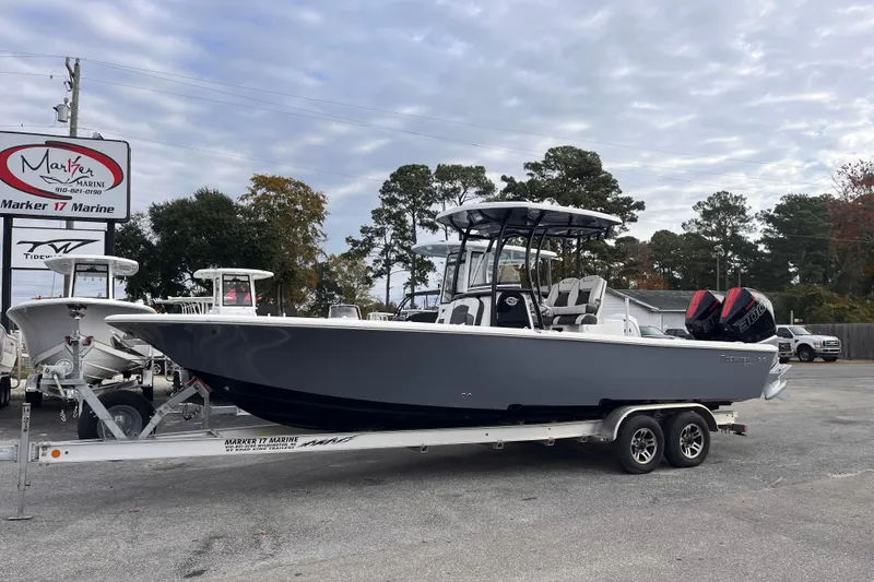 Slide: The Image of 2023 Tidewater 2700 Carolina Bay boat on trailer at Marker 17 Marine dealership. - 1