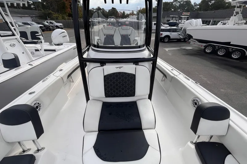 Slide: The Image of 2023 Tidewater 2700 Carolina Bay boat interior with seating and console view. - 11