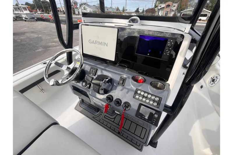 Slide: The Image of 2023 Tidewater 2700 Carolina Bay boat console with Garmin navigation system. - 8