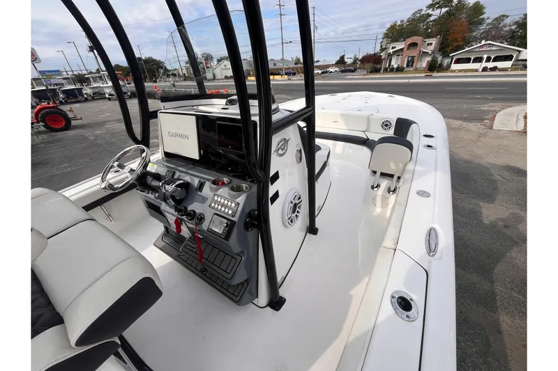 Slide: The Image of 2023 Tidewater 2700 Carolina Bay boat interior with Garmin navigation system. - 9