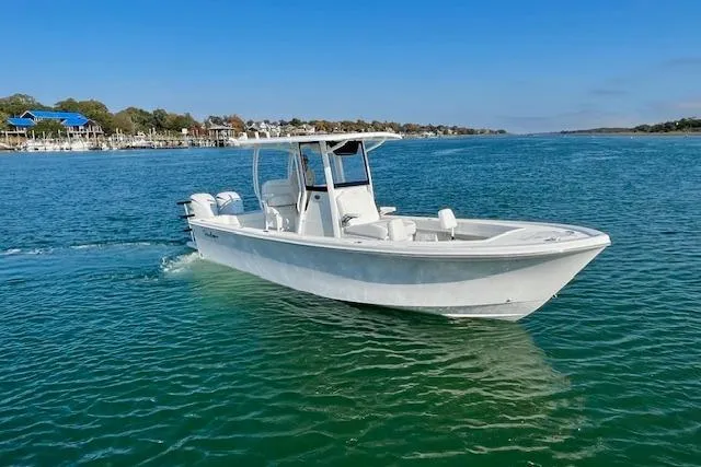 Slide: The Image of 2026 Pair Customs 24 Center Console DV boat cruising on clear blue water. - 3