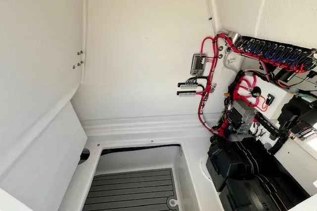 Slide: The Image of 2026 Pair Customs 24 Center Console DV boat interior wiring and components. - 7