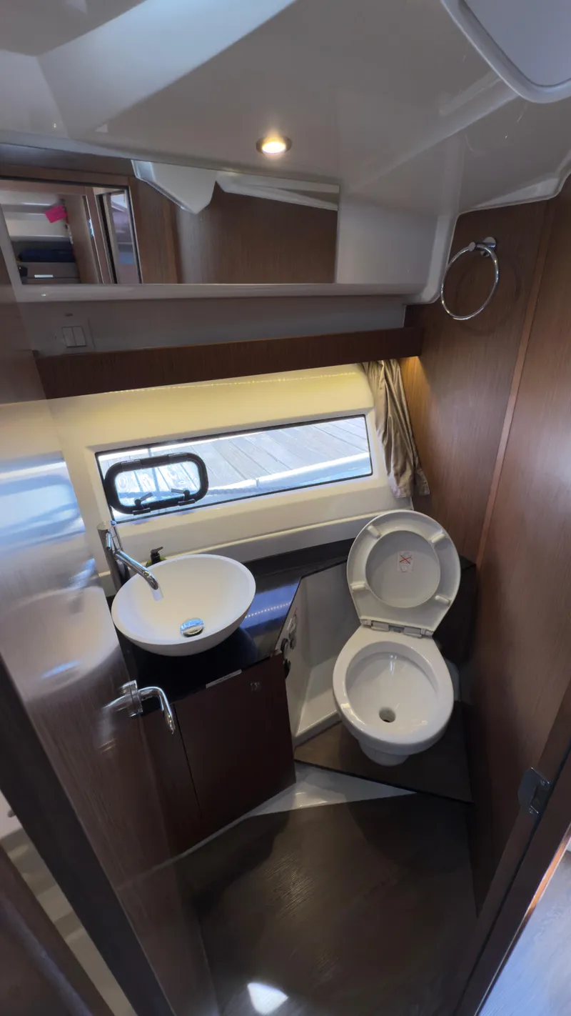 Slide: The Image of Interior of 2019 Jeanneau NC Weekender 1095 boat bathroom with modern fixtures. - 21