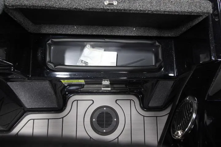 Slide: The Image of 2026 BassCat Cougar FTD SP boat storage compartment with sleek interior design. - 11