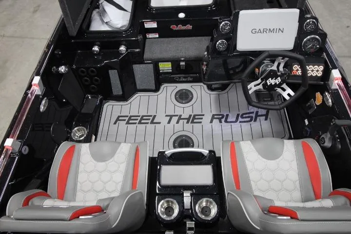 Slide: The Image of 2026 BassCat Cougar FTDSP boat interior with Garmin system and "Feel the Rush" flooring. - 13