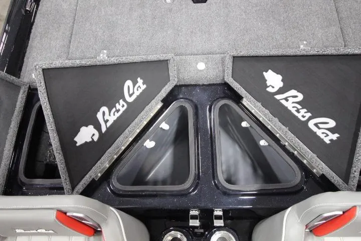 Slide: The Image of 2026 BassCat Cougar FTD SP boat interior with storage compartments and logo. - 14
