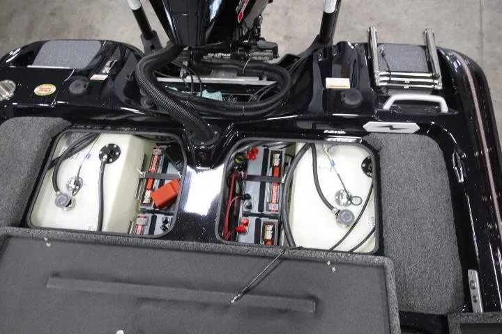 Slide: The Image of 2026 BassCat Cougar FTD SP boat interior showing battery and fuel tank compartments. - 18