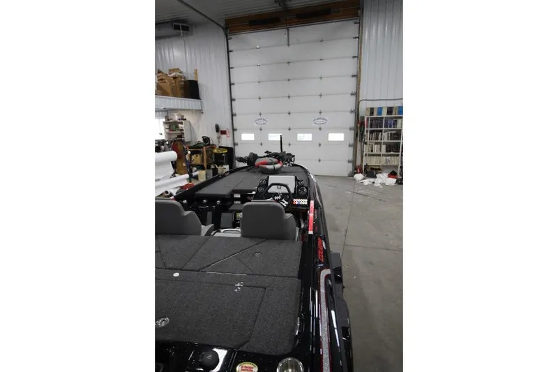 Slide: The Image of 2026 BassCat CougarFTDSP boat in a garage, showcasing interior and equipment. - 22