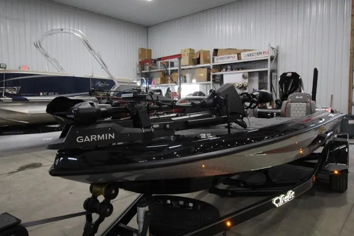 Slide: The Image of 2026 BassCat Cougar FTDSP boat in a showroom, featuring Garmin equipment. - 3