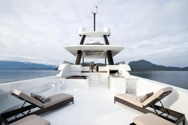 Slide: The Image of Luxurious 2019 Crescent Semi-Displacement yacht deck with lounge chairs and scenic ocean view. - 14