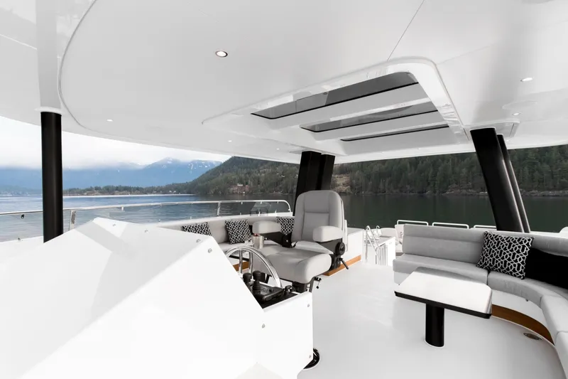 Slide: The Image of Luxurious 2019 Crescent Semi-Displacement yacht interior with scenic lake and mountain views. - 16