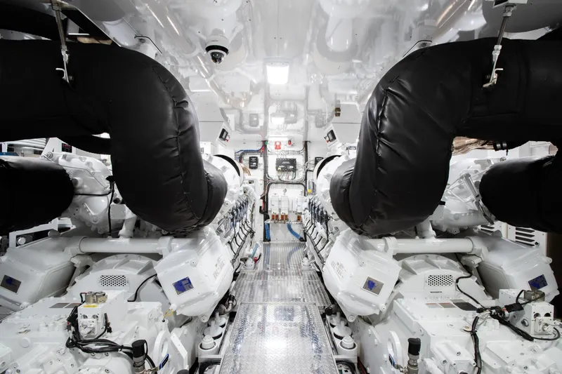 Slide: The Image of Engine room of 2019 Crescent Semi-Displacement yacht with advanced machinery and black exhaust pipes. - 22