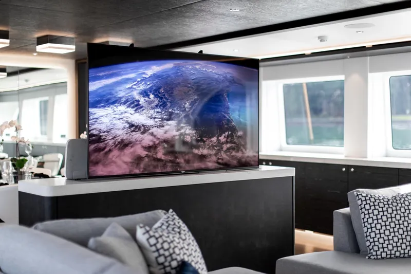 Slide: The Image of Luxurious 2019 Crescent Semi-Displacement yacht interior with large TV and modern decor. - 5