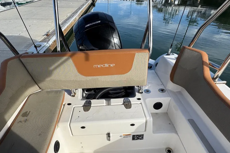 Slide: The Image of 2022 Zodiac Medline 6.8 boat interior with Mercury engine at dock. - 13