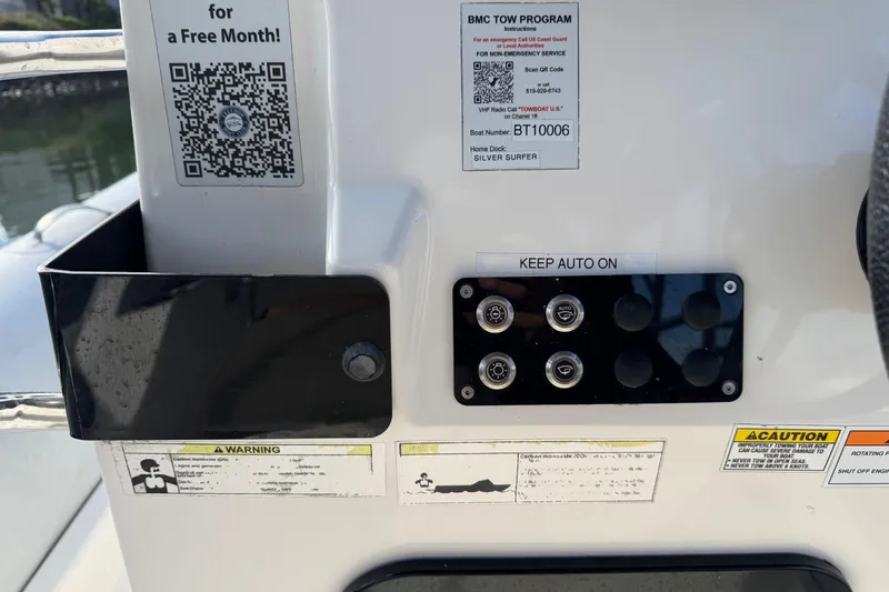 Slide: The Image of Control panel of a 2022 Zodiac Medline 6.8 boat with QR codes and warnings. - 27