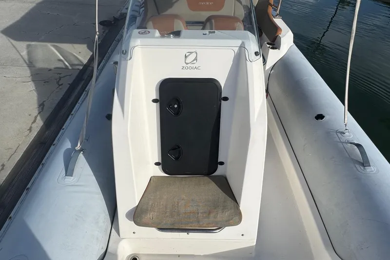 Slide: The Image of 2022 Zodiac Medline 6.8 boat interior, featuring seating and control panel. - 35