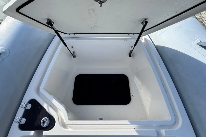 Slide: The Image of Open storage compartment on 2022 Zodiac Medline 6.8 boat, showcasing interior space. - 41