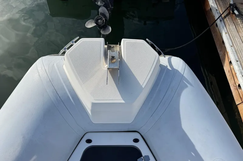 Slide: The Image of Bow of Zodiac Medline 6.8 boat, 2022 model, docked with visible propeller. - 43