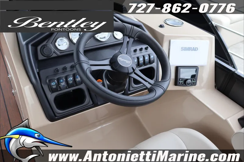 Slide: The Image of 2026 Bentley Pontoons Legacy 223 DL Navigator dashboard with steering wheel and controls. - 11
