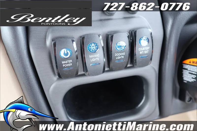 Slide: The Image of Control panel of 2026 Bentley Pontoons Legacy 223 DL Navigator with labeled switches. - 13