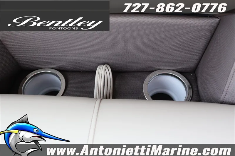 Slide: The Image of 2026 Bentley Pontoons Legacy 223 DL Navigator cup holders, Antonietti Marine branding. - 19