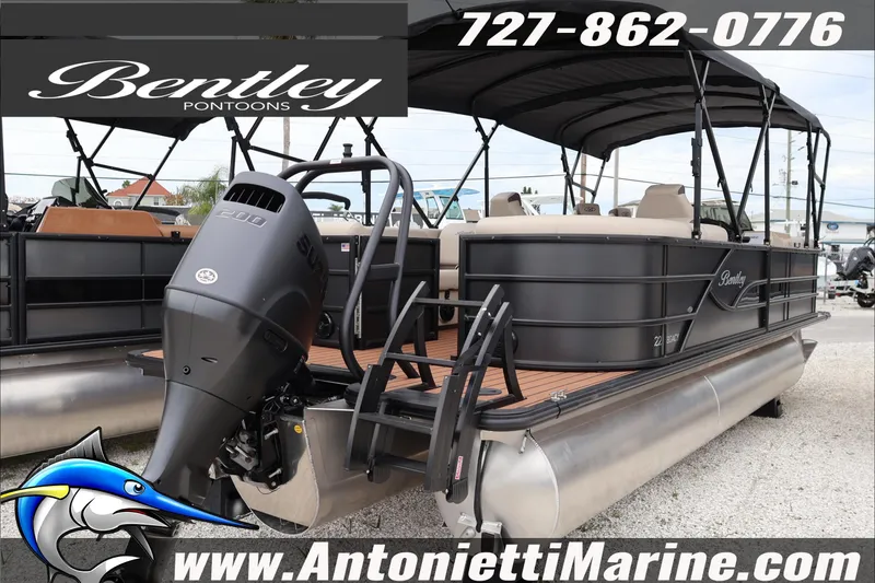 Slide: The Image of 2026 Bentley Pontoons Legacy 223 DL Navigator with outboard motor, displayed at Antonietti Marine. - 23