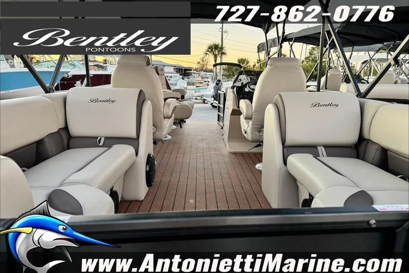 Slide: The Image of 2026 Bentley Pontoons Legacy 223 DL Navigator interior with luxurious seating, showcased by Antonietti Marine. - 4
