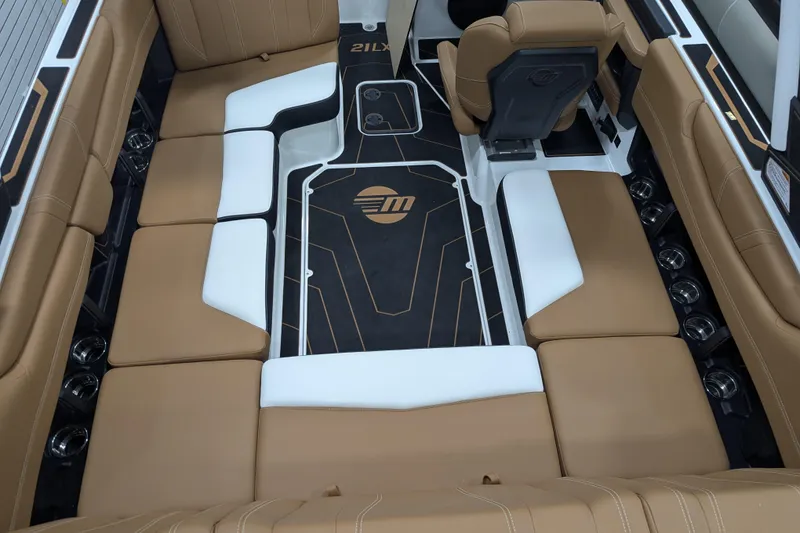 Slide: The Image of 2026 Malibu Wakesetter 21 LX interior with tan seating and modern design. - 11