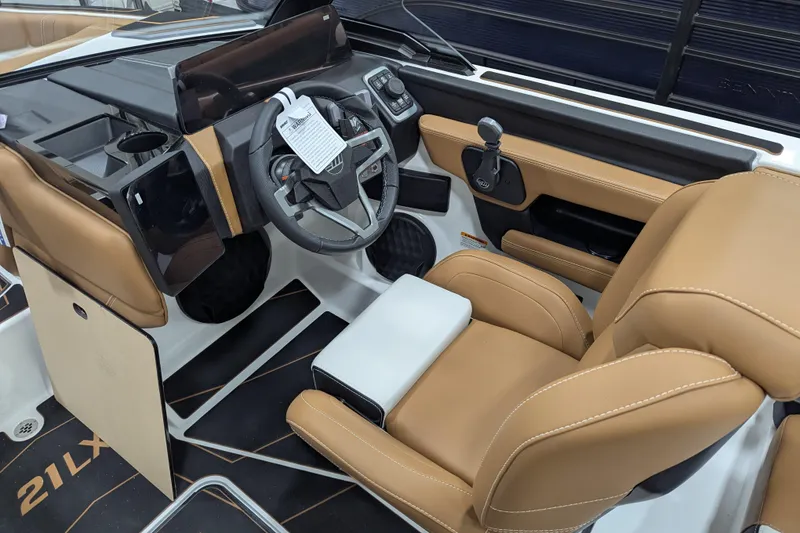 Slide: The Image of 2026 Malibu Wakesetter 21 LX interior with tan seating and sleek design. - 16
