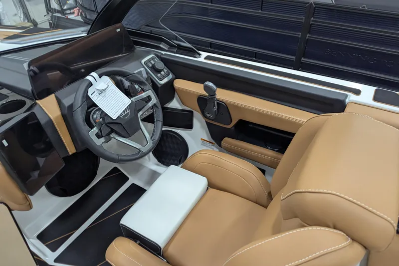 Slide: The Image of 2026 Malibu Wakesetter 21 LX boat interior with tan seats and modern dashboard. - 17