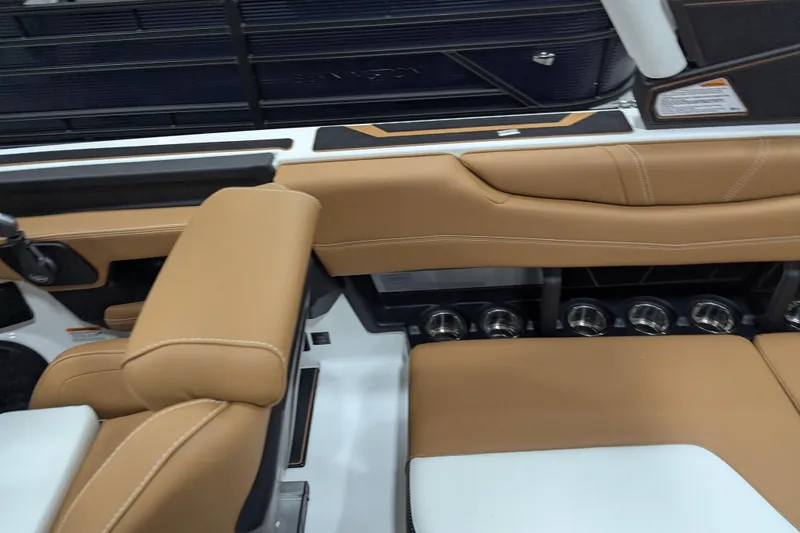 Slide: The Image of 2026 Malibu Wakesetter 21 LX interior with tan leather seats and modern dashboard. - 18
