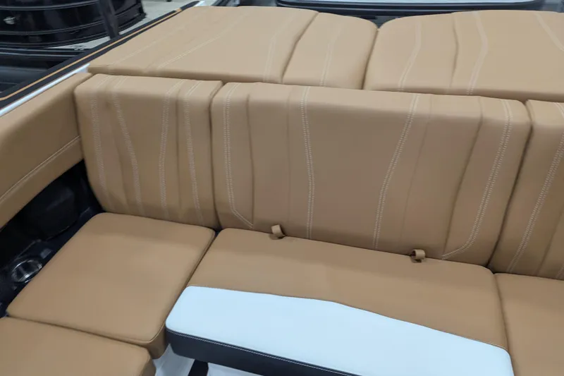Slide: The Image of Luxurious tan seating in 2026 Malibu Wakesetter 21 LX boat interior. - 20