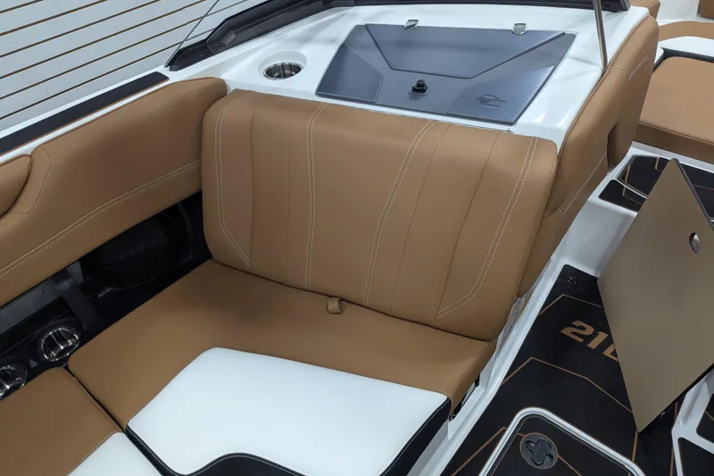 Slide: The Image of 2026 Malibu Wakesetter 21 LX interior with tan and white seating, sleek design. - 25