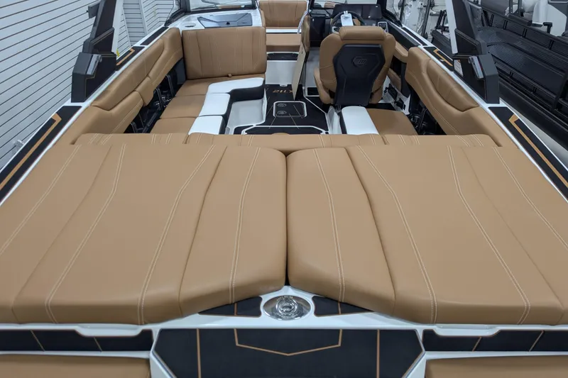 Slide: The Image of 2026 Malibu Wakesetter 21 LX interior with tan seating and sleek design. - 9