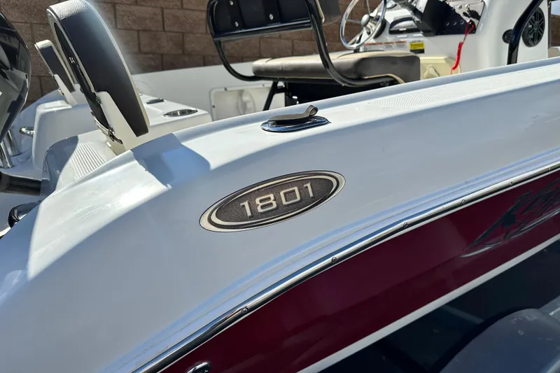 Slide: The Image of Key Largo 1801 boat interior, 2021 model, featuring beige seating and white deck. - 10