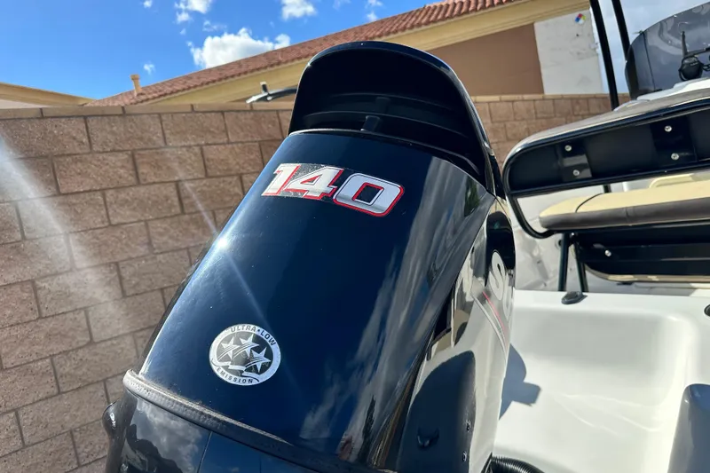 Slide: The Image of 2021 Key Largo 1801 boat interior with beige seating and white deck. - 11