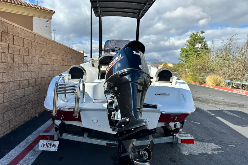 Slide: The Image of 2021 Key Largo 1801 boat with Suzuki outboard motor on trailer. - 4