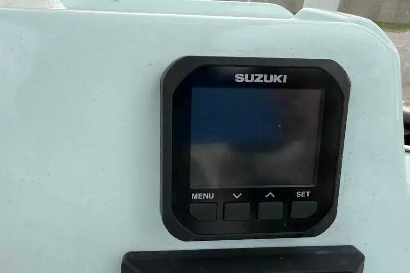 Slide: The Image of Suzuki display panel on 2023 Shallow Sport 25 X3 boat dashboard. - 17