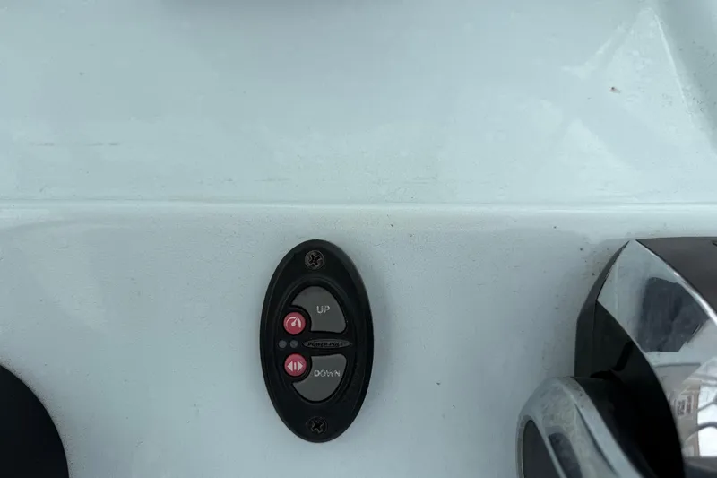 Slide: The Image of Control panel on 2023 Shallow Sport 25 X3 boat, featuring up and down buttons. - 21