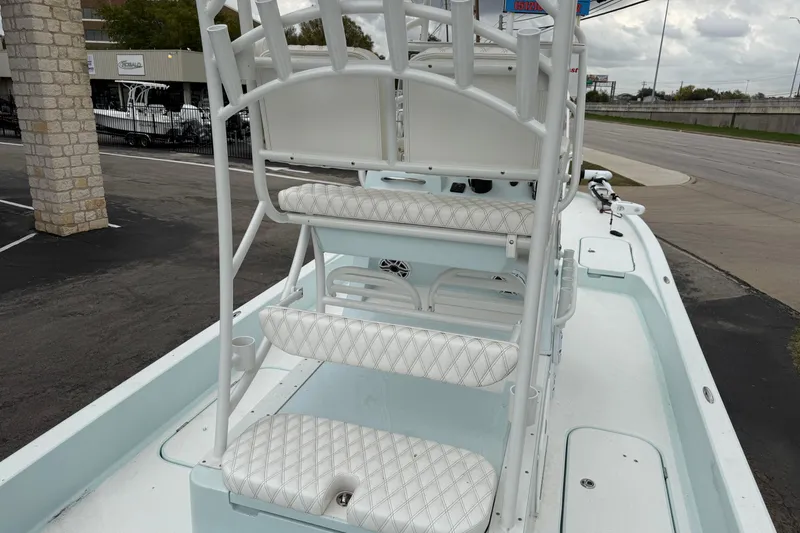 Slide: The Image of 2023 Shallow Sport 25 X3 boat interior with white cushioned seating and sleek design. - 29