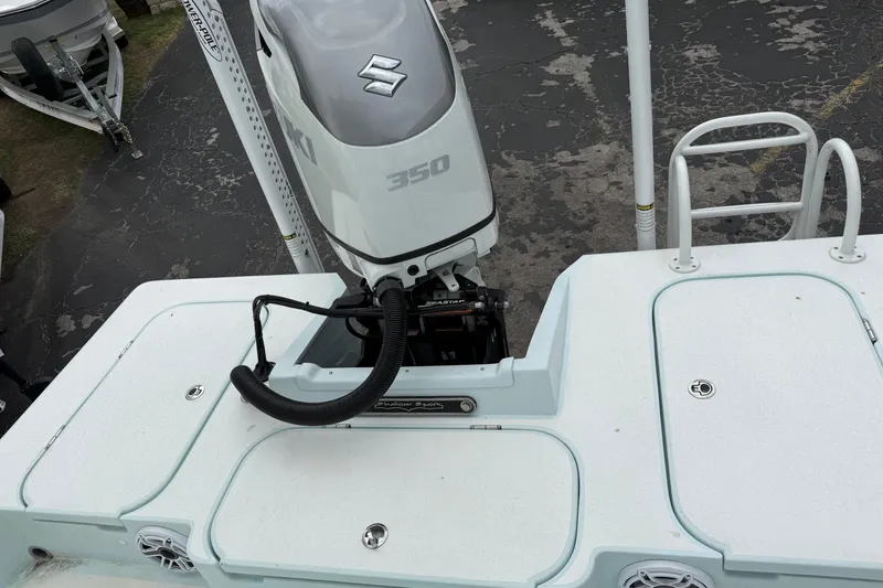 Slide: The Image of 2023 Shallow Sport 25 X3 boat with Suzuki 350 outboard motor, rear deck view. - 33