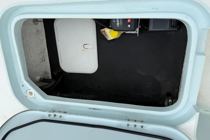 Slide: The Image of Open storage compartment in 2023 Shallow Sport 25 X3 boat. - 39