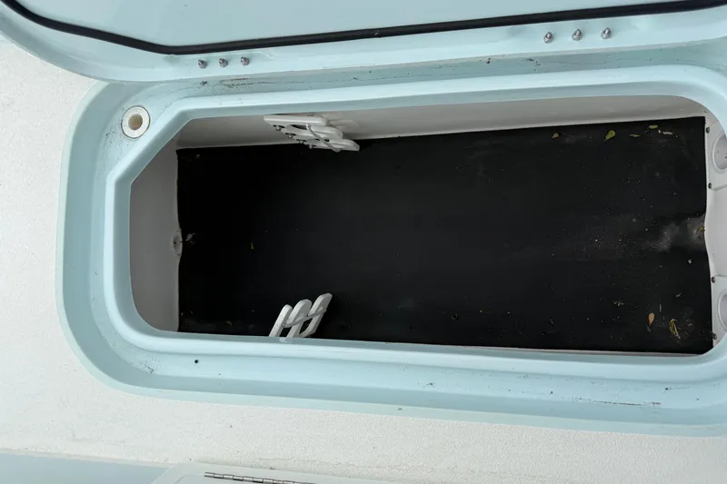 Slide: The Image of Open storage compartment in 2023 Shallow Sport 25 X3 boat. - 41