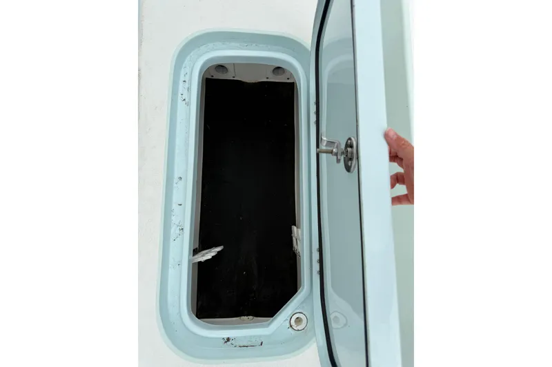 Slide: The Image of Open storage compartment on 2023 Shallow Sport 25 X3 boat. - 42