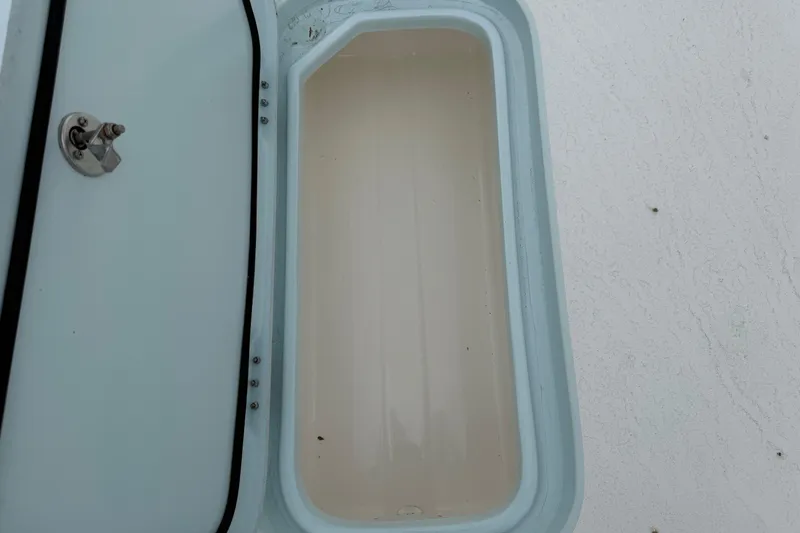 Slide: The Image of Open storage compartment on 2023 Shallow Sport 25 X3 boat. - 46