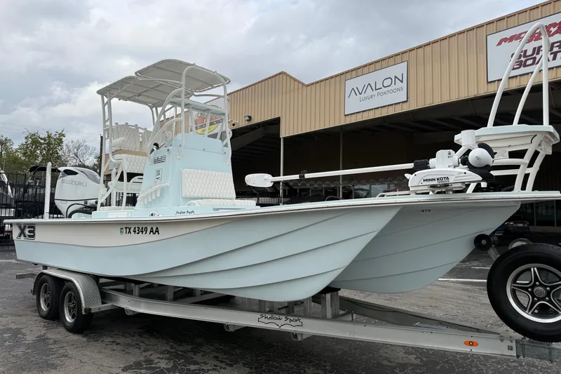 Slide: The Image of 2023 Shallow Sport 25 X3 boat on trailer outside Avalon Luxury Pontoons. - 6