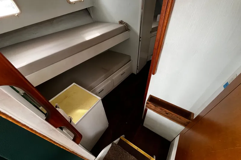 Slide: The Image of 1974 Tollycraft 37 Convertible interior with bunk beds and storage. - 31