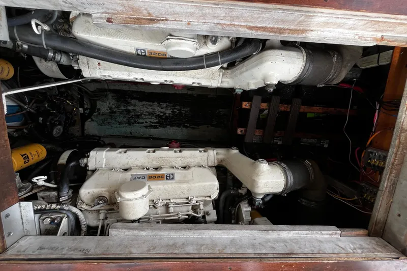 Slide: The Image of Engine compartment of a 1974 Tollycraft 37 Convertible boat, featuring dual CAT 3208 engines. - 41